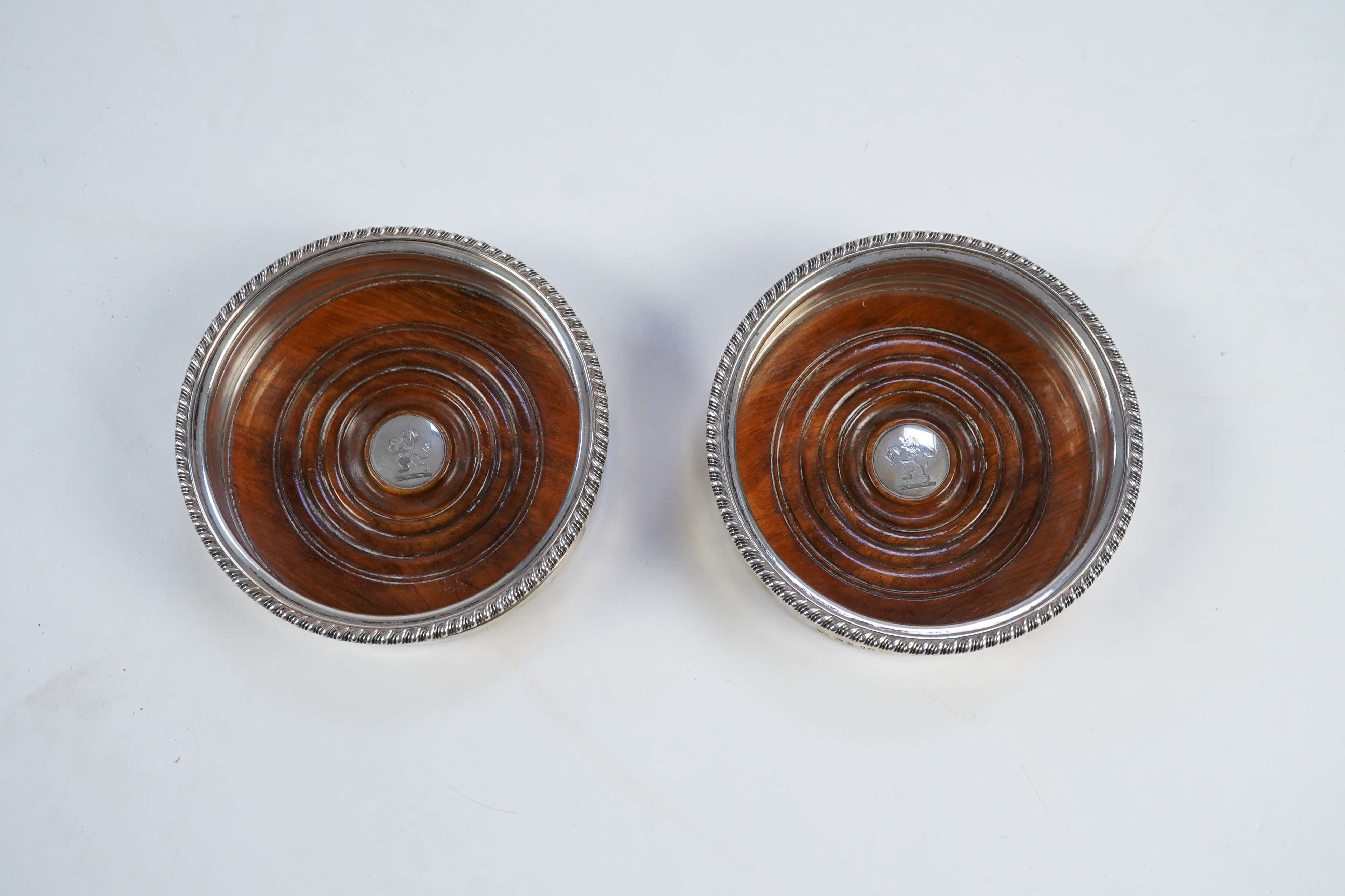 A pair of late George III silver wine coasters, by William Bateman